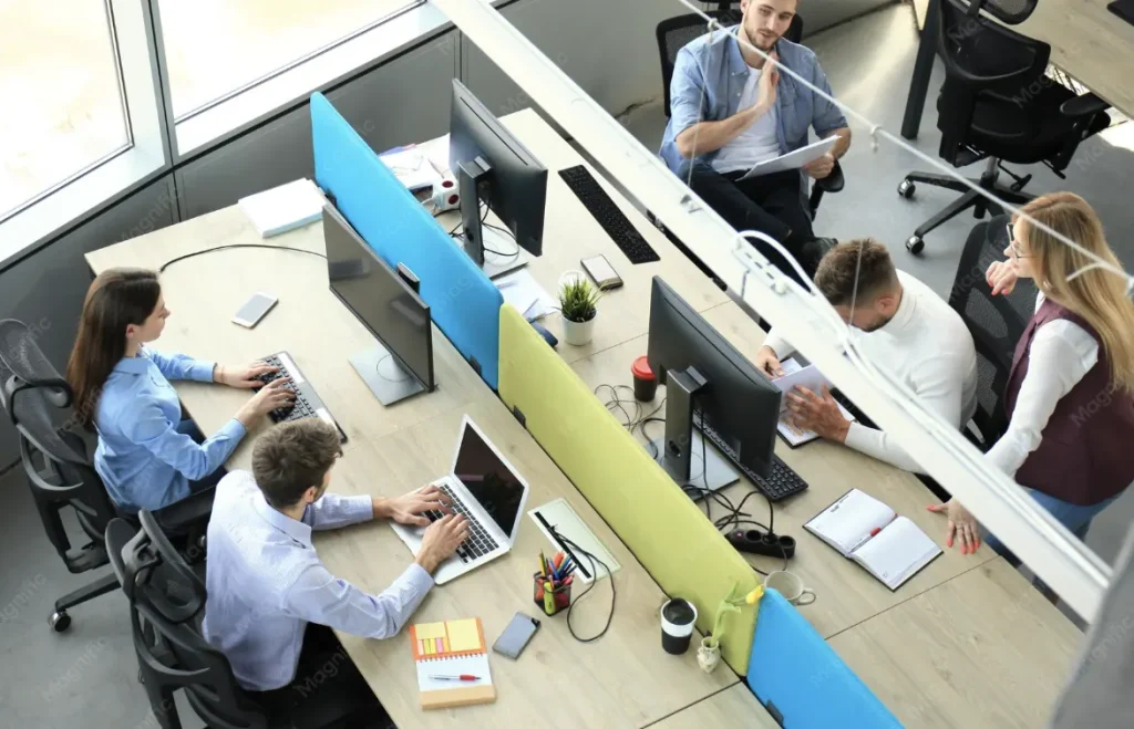 Team working at shared desks, seen from above